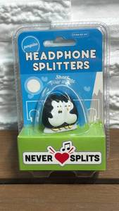 lot 20 image: Spinning Hat Penguins Headphone Splitters Never Splits
