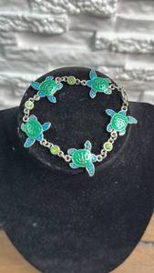 lot 24 image: Sea Turtle Charm Bracelet with Green and Blue Enamel Accents