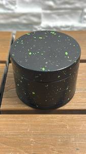 lot 79 image: Herb Grinder - 4-Piece Black with Green Speckle
