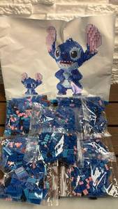 lot 109 image: Building Block Set Blue Stitch Character with Pink Ears (Large and Small Figures)
