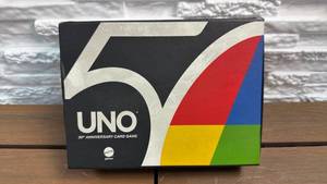 lot 129 image: Mattel UNO 50th Anniversary Card Game with Gold Coin