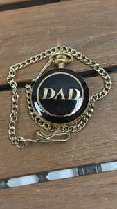 lot 138 image: Pocket Watch with Gold-Tone Chain and DAD on the front