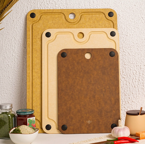 lot 163 image: 3-Piece Natural High-Density Wood-Fiber Composite Cutting Board Set  - Retail $33