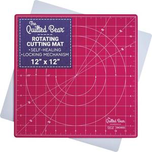lot 171520 image: The Quilted Bear 12 x 12 Rotating Self-Healing Cutting Mat, Pink