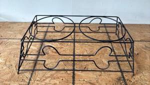 lot 111 image: Heavy Wire Dog Bowl Holder with Bone Shaped Decoration Approximately 8 inches Tall and 19 inches wide