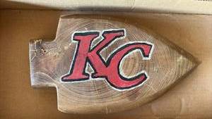 lot 152 image: Hand Carved Kansas City Chiefs Arrowhead Decor 11 inches long