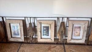 lot 173 image: Pair Heavy Rustic Wood and Metal Wall Decor with Picture Frames for 5 by 7 Photos and Coconut Windchime