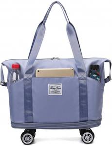 lot 7670 image: Expandable Rolling Duffle Bag, Travel Tote with Wheels, Waterproof Carry-On  Missing wheel 