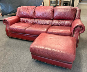 Leather burgundy sofa 32 x 86 x 38 inWith ottoman15 x 32 x 26 in