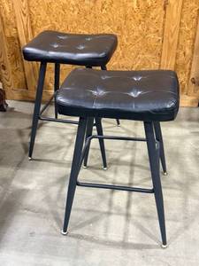 lot 818 image: Pair of black saddle style barstools 25 x 19 x 18 in