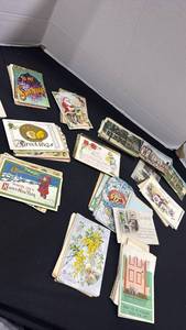 lot 1049 image: Vintage post cards dating back early 1900s have been written on