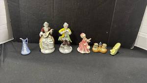 lot 1063 image: Vintage hand-painted porcelain figurines depicting an 18th-century or Victorian-style musical couple, vintage lusterware ceramic salt and pepper shaker set with a central blue bird figurine holder, made in Japan and more
