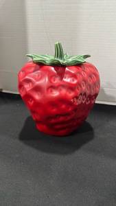 lot 1105 image: Red ceramic strawberry-shaped cookie jar with a green stem and leaf lid 10 inches tall
