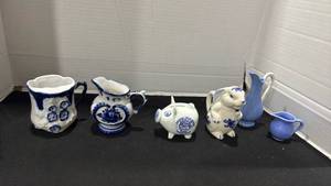 lot 1129 image: Flow blue porcelain mustache mug, creamer and more