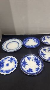 lot 1133 image: Flow blue porcelain plates biggest is 8 inches some small chips