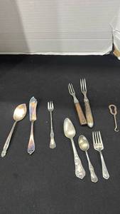lot 1149 image: Vintage metal shoe button hook, and various silver plated flatware