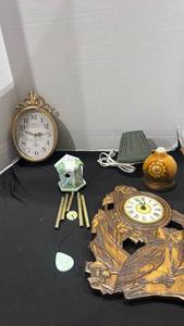 lot 1184 image: Wood carved clock with owl on it, wind chime, clock and wood burned lamp with sunflower motif