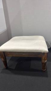 lot 1192 image: Wooden foot stool with upholstery top 8x14x14 some stains on upholstery