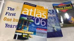 lot 1197 image: Book Lot 5 Items The First One Hundred Years Wichita Eagle The Road Dips and World Atlas