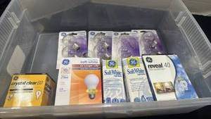lot 1229 image: Light bulbs in sterilite container no lid not all boxes are full