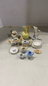 lot 2011 image: Miniature pitchers, teapots and dishes, no matching lids