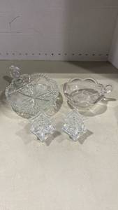 lot 2025 image: Glass candleholders and dishes
