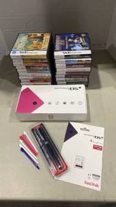 lot 2026 image: Nintendo DS with games and accessories