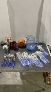 lot 2061 image: Vintage metal cocktail shakers, blue glass pitcher, coasters in holder and new blue acrylic flatware 20 pieces