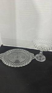 lot 2380 image: Clear pressed glass pedestal dish with an open lattice rim and ribbed pedestal base 7 inches tall, and clear glass cake plate