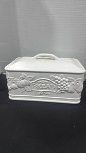 lot 2382 image: White glazed ceramic bread box featuring an embossed fruit and grape design 9x13x9