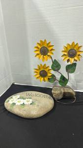 lot 2388 image: Handmade metal triple sunflower sculpture featuring yellow petals and green leaves mounted on a stone base 14 inches tall, hand painted welcome rock 9x11