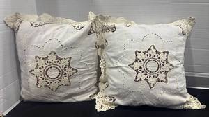 lot 2411 image: Pair of Decorative Pillow cases with Lace Trim over pillows with 16 qt Sterilite container