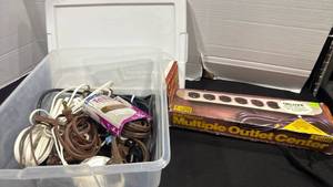 lot 2430 image: 16 qt Sterilite container with power strips and extension cords