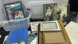 lot 2447 image: Picture frames, photo albums and more with Rubbermaid container