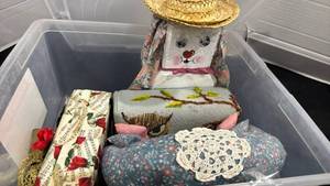 lot 2454 image: Door stops with plastic storage box  4.6 gal