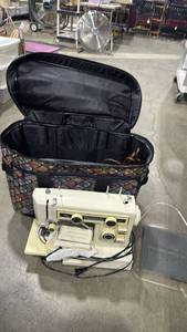lot 2488 image: Kenmore 10 sewing machine with rolling bag and accessories