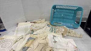 lot 2507 image: Vintage linen and doilies and plastic basket