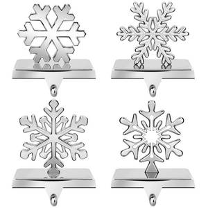 lot 1039 image: URATOT Pack of 4 Christmas Stocking Holders Snowflake Stocking Hangers Mantel Stocking Hooks for Christmas Decoration, Silver - Retail $24