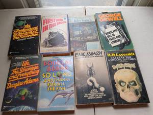 lot 115 image: Lot of 8 Science Fiction Books Douglas Adams, H.G. Wells, Jules Verne, George Orwell, Isaac Asimov, H.R. Lovecraft