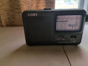 lot 133 image: Coby CX-WB15 AMFM Weather Band Alert Radio