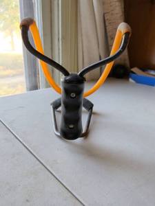 lot 163 image: Slingshot with Orange Band and Black Handle