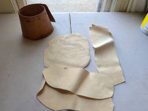 lot 169 image: Cut Hide Pieces and Cylindrical Form Craft Lot
