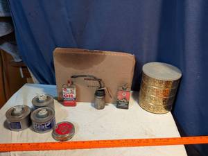 lot 214 image: Vintage Household Oil and Lubricant Collectibles Lot, Three empty safe heat cans