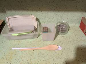 lot 562 image: Kitchen Lot Plastic Containers, Glass Jar with Metal Insert, Small Tin, Spoon