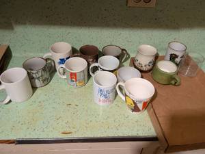 lot 563 image: Lot of 14 Ceramic Coffee Mugs with Assorted Designs and Colors