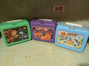lot 567 image: Lot of 3 Character Lunch Boxes Disney Lion King, Smurfs, A Bugs Life
