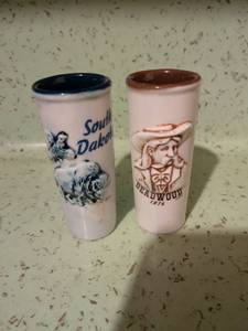 lot 573 image: South Dakota and Deadwood 1876 Ceramic Souvenir Shooter Glasses Lot of 2