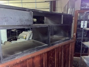 lot 122 image: large black wooden entertainment center