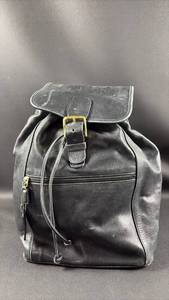 lot 34 image: Coach Black Leather Backpack with Gold Tone Buckle and Drawstring Closure
