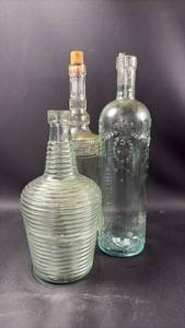 lot 76 image: 3) Decorative Glass Bottles with Embossed and Ribbed Designs